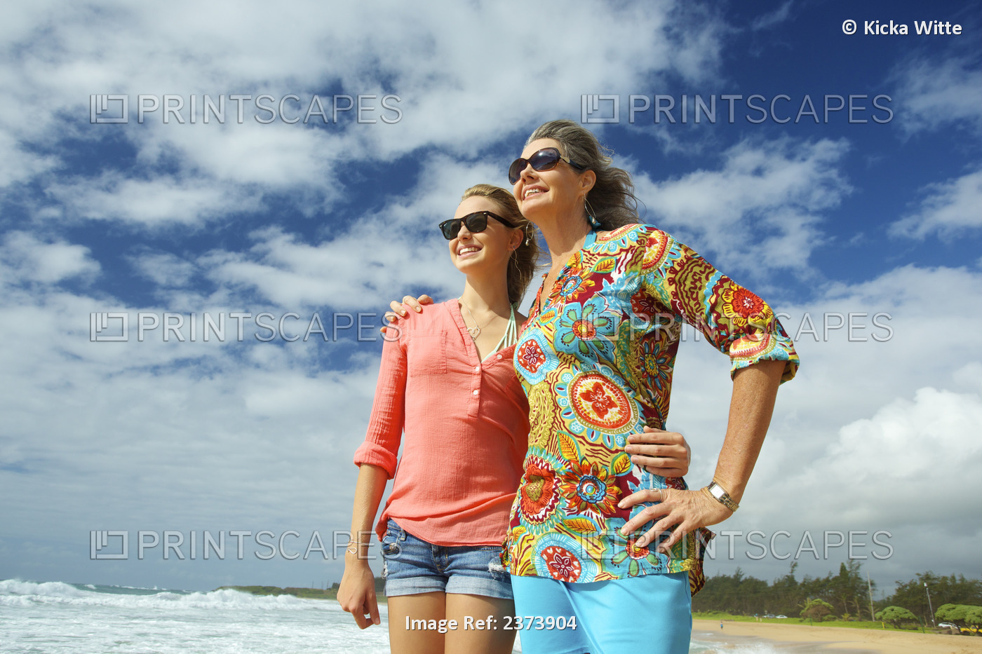 A Mother And Daughter Together On The Beach; Kauai, Hawaii, United States Of ...