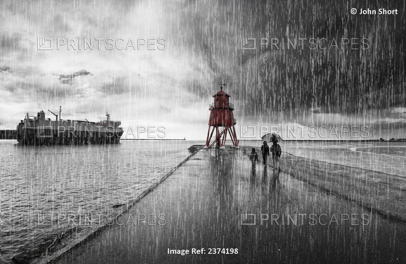 A Family Walking In The Pouring Rain Along Harbour Beach With Groyne Lighthouse ...