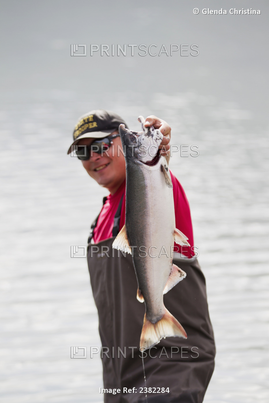An Alaska Native Man Shows Off His Silver Salmon Freshly Caught In Jim Creek, ...