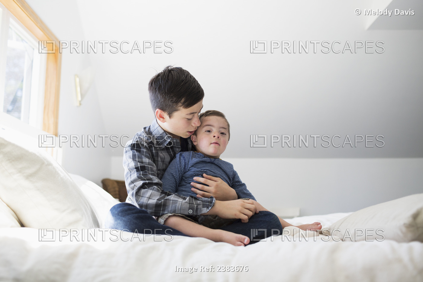 An Older Brother Holds His Young Brother With Down Syndrome; Victoria, British ...