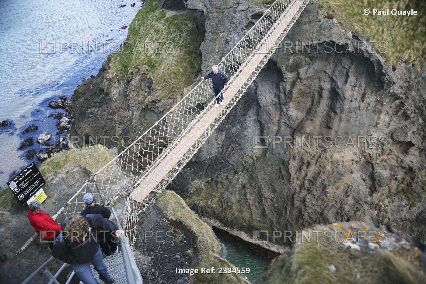 Crossing Carrick-A-Rede Rope Bridge, A Suspension Bridge Which Spans 20 Metres ...