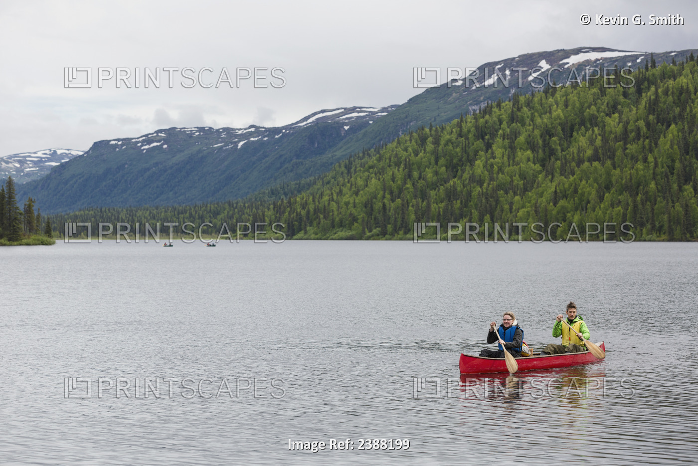 Couple In Red Canoe On Byers Lake With Green Tree Covered Hills And Talkeetna ...