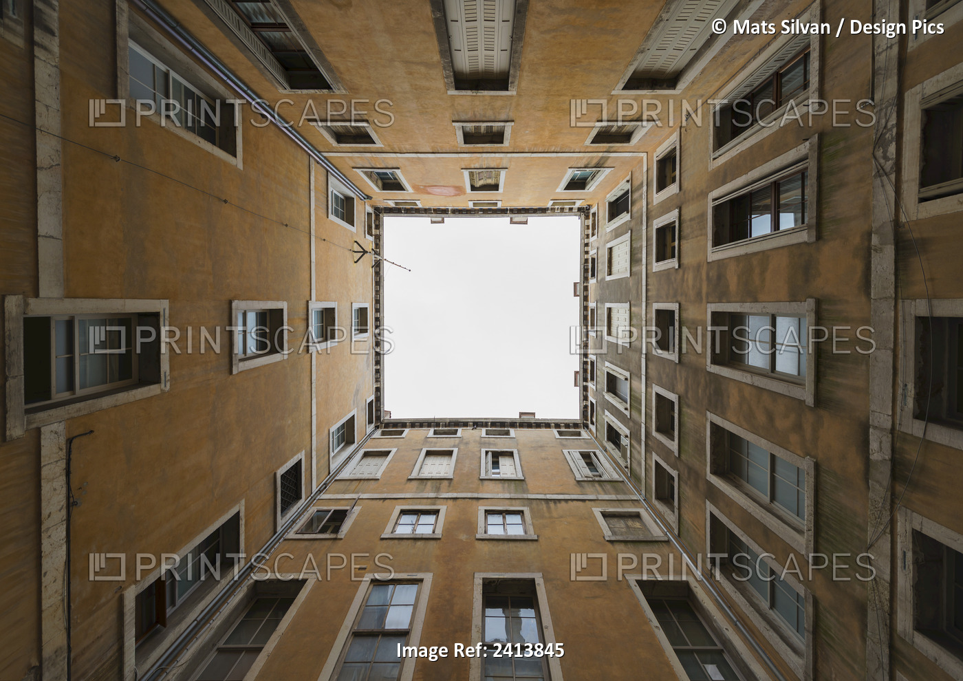 Low Angle View To The Sky From Inside The Four Walls Of A Building; Venice, ...