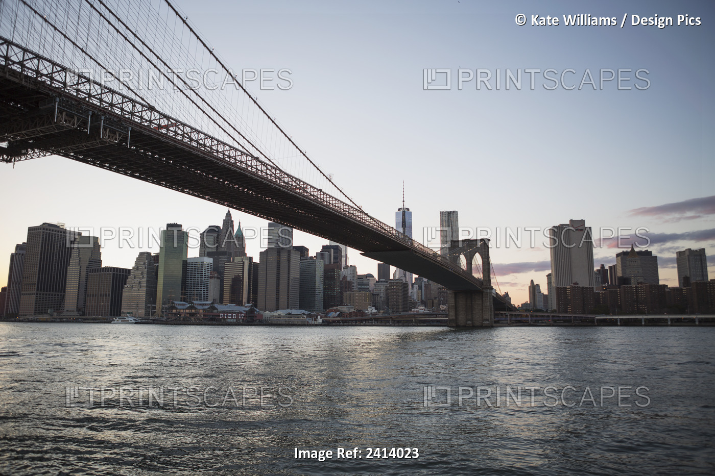 Brooklyn Bridge Heading Into Manhattan At Dusk; New York City, New York, United ...