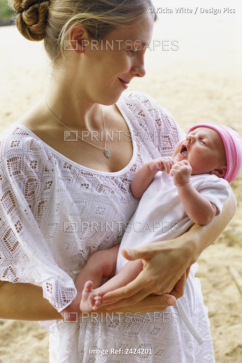 A Mother Holding Her Newborn Daughter; Kauai, Hawaii, United States Of America