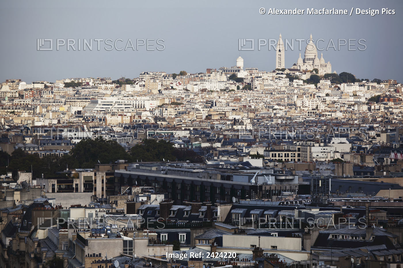 Cityscape Of Paris And Buildings Against A Blue Sky; Paris, France