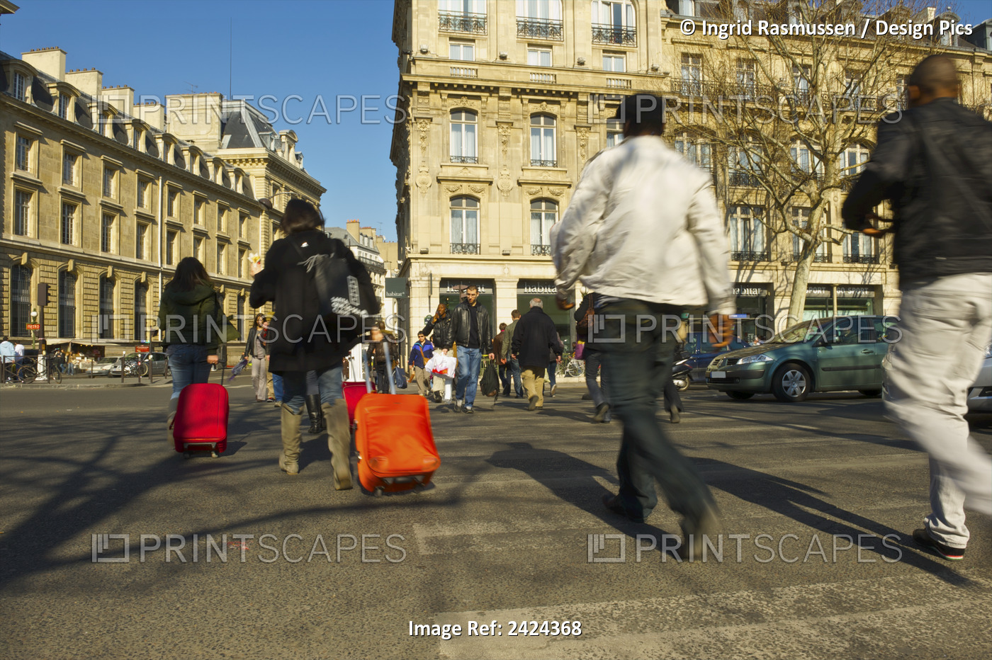 Pedestrians Crossing A Street At An Intersection, Some Of Them Rolling Luggage ...