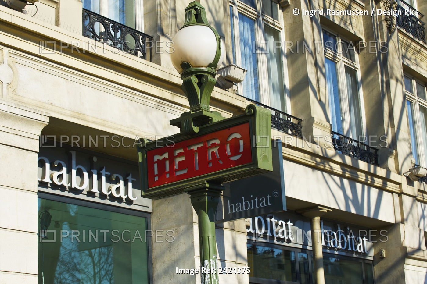 A Sign For The Metro Outside A Retail Building; Paris, France
