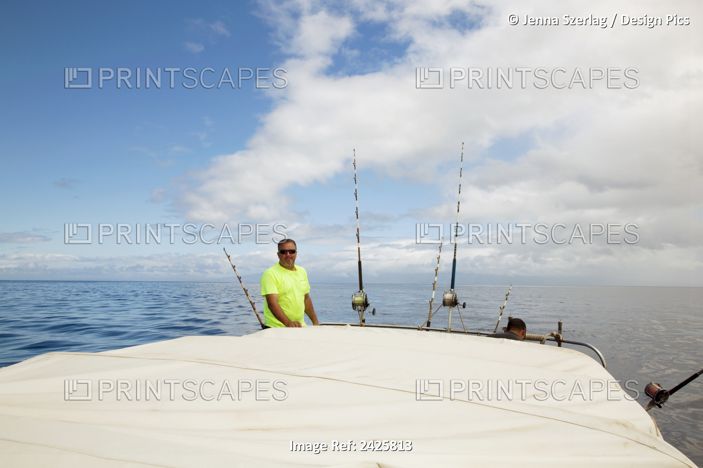 Hawaii, Maui, Man Poses With Poles On Fishing Boat