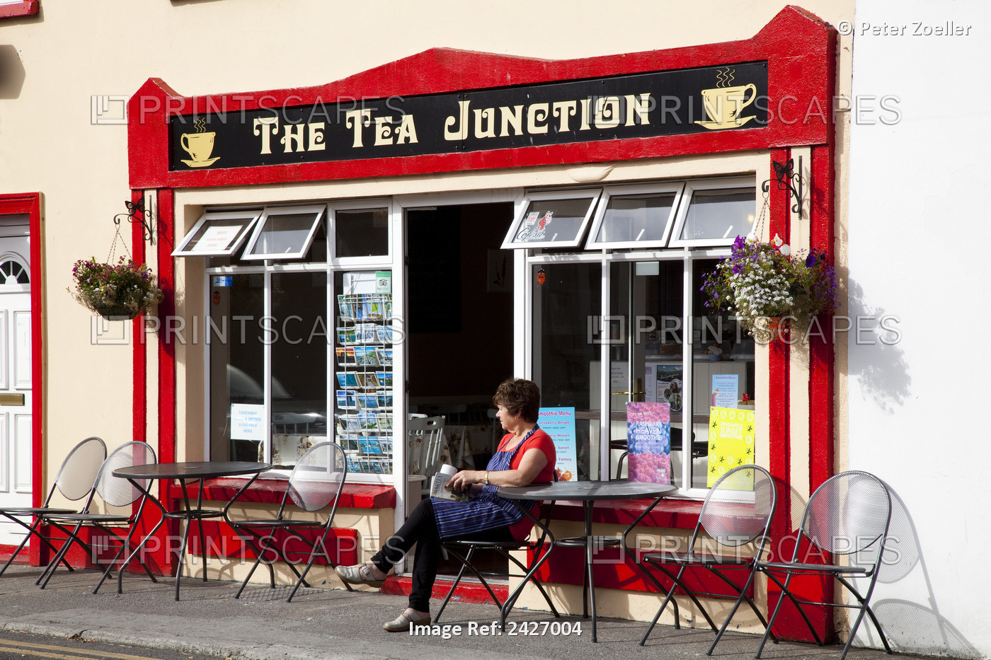 A Woman Wearing An Apron Sits Outside A Cafe Resting; Ballyvaghan, County ...