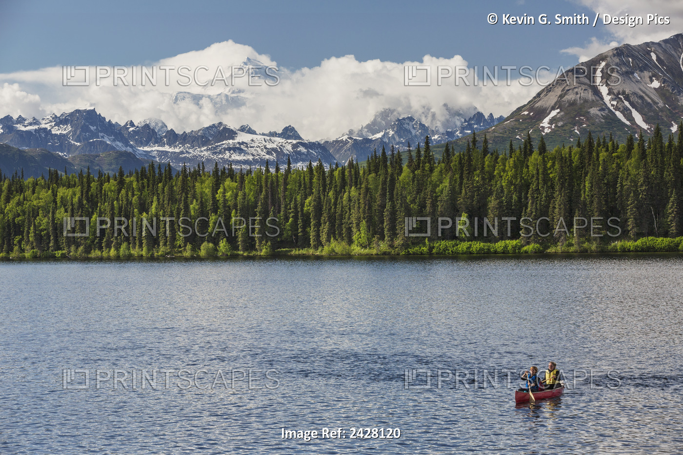 Two Women And Young Girl In A Red Canoe On Byers Lake With Green Forested ...
