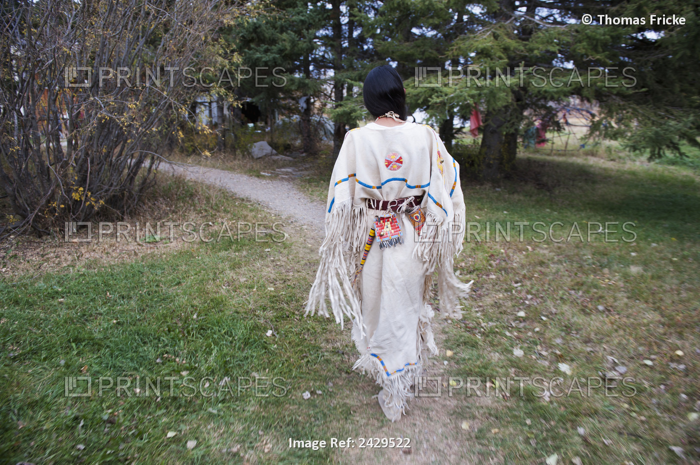 Native American Woman Walking Outside Wearing A Traditional Dress; Rossburn, ...