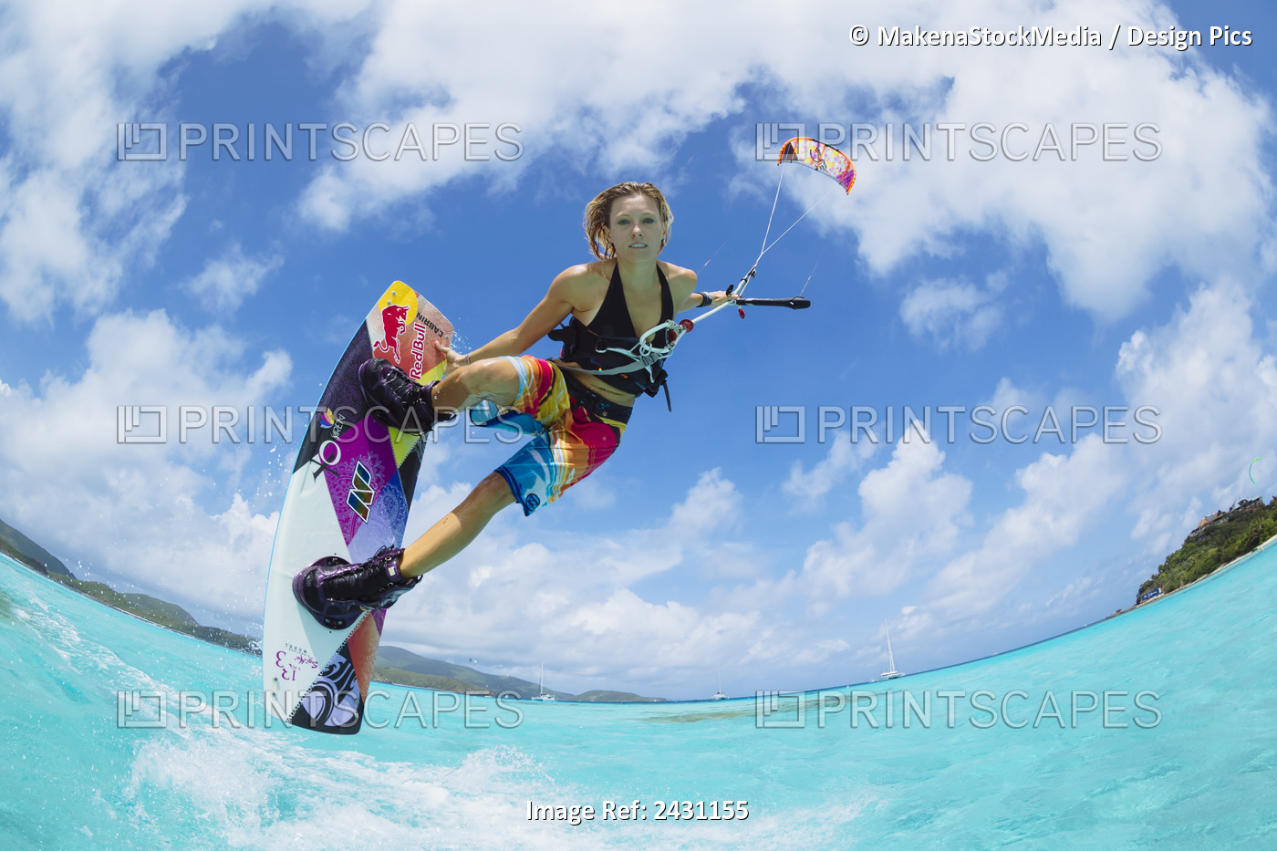 Professional Kiteboarder Susi Mai Kitesurfing Over The Crystal Blue Waters; ...