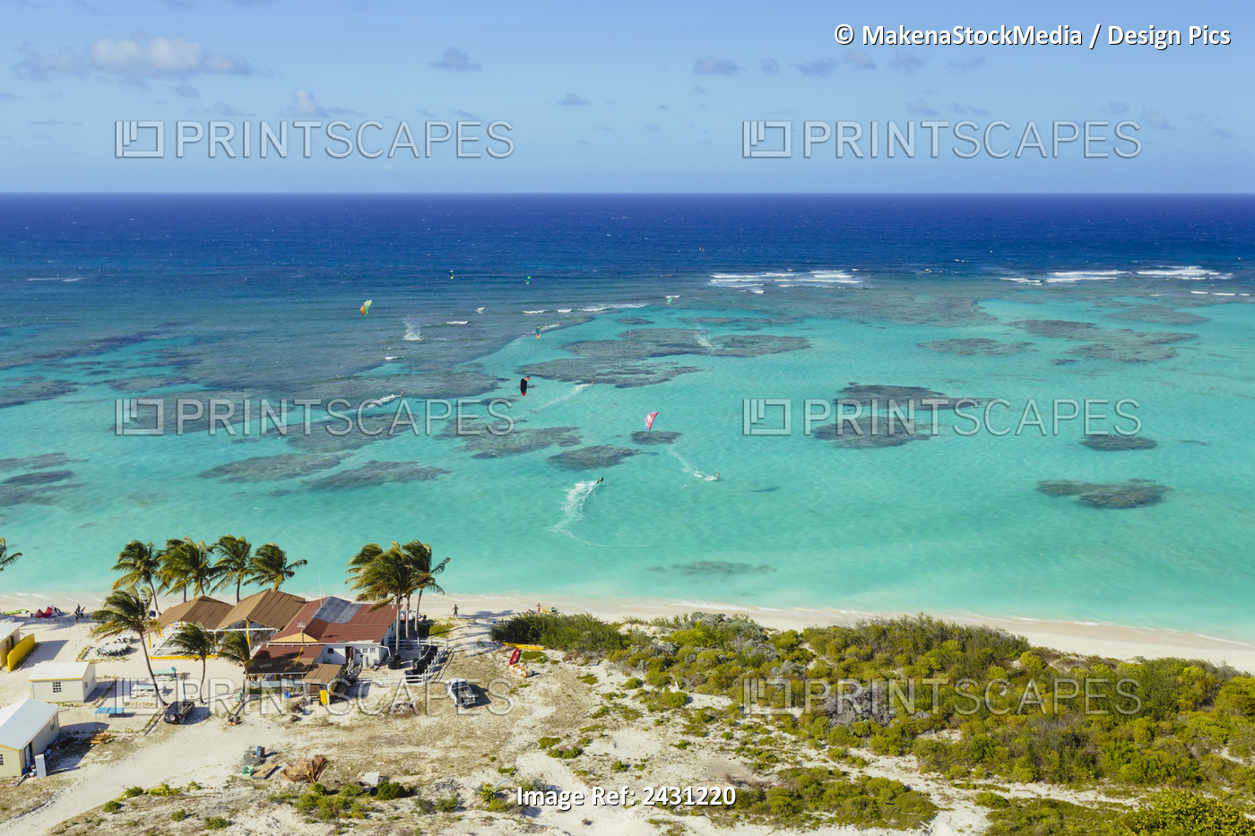 Aerial View Of Kiteboarders Riding Across The Crystal Clear Blue Waters; ...