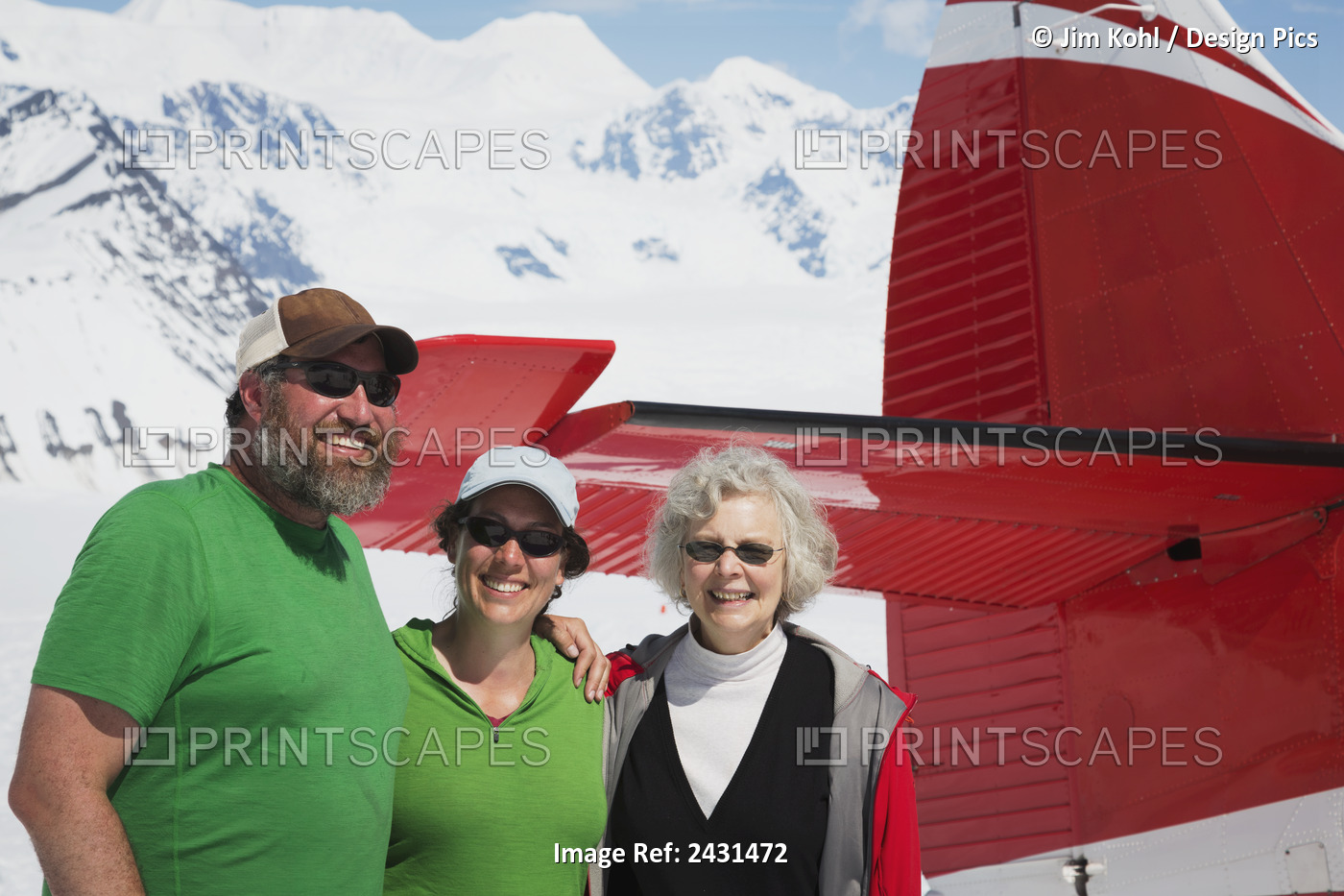 A Happy Family Posing With Their Flightseeing Plane On The Ruth Glacier In The ...