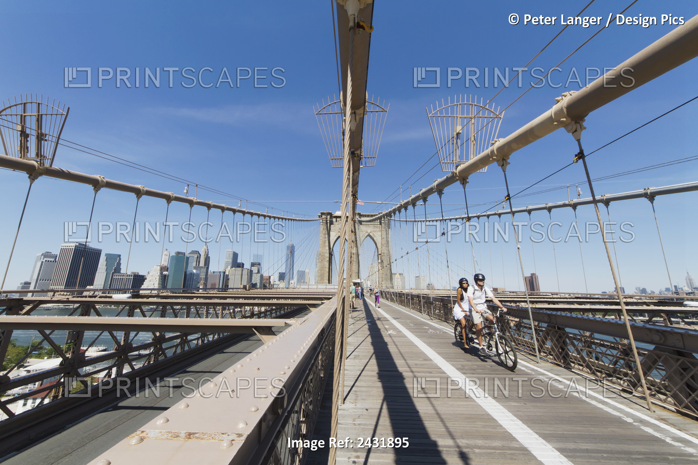 Couple On A Tandem Bicycle On The Pedestrian Walkway On The Brooklyn Bridge, ...