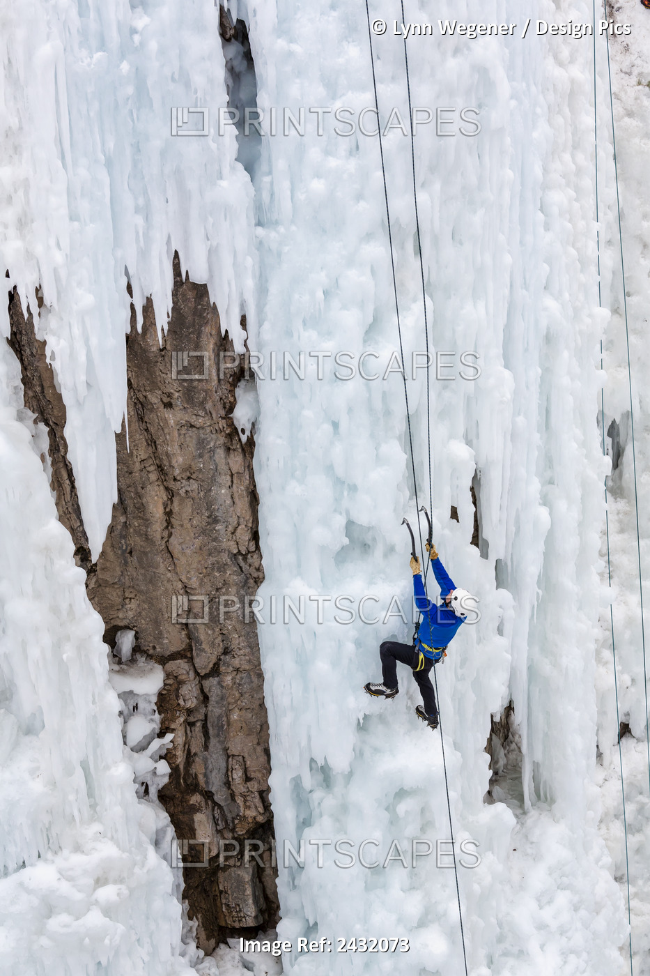 A Man Climbs Up An Ice Flow In The Ice Park At Ouray, Colorado, Winter, Usa.