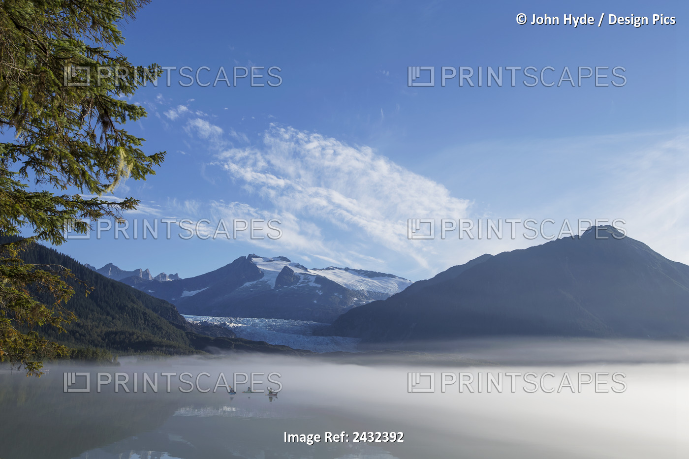 Three Kayakers Paddle The Shoreline Of Mendenhall Lake As Morning Fog Clears, ...