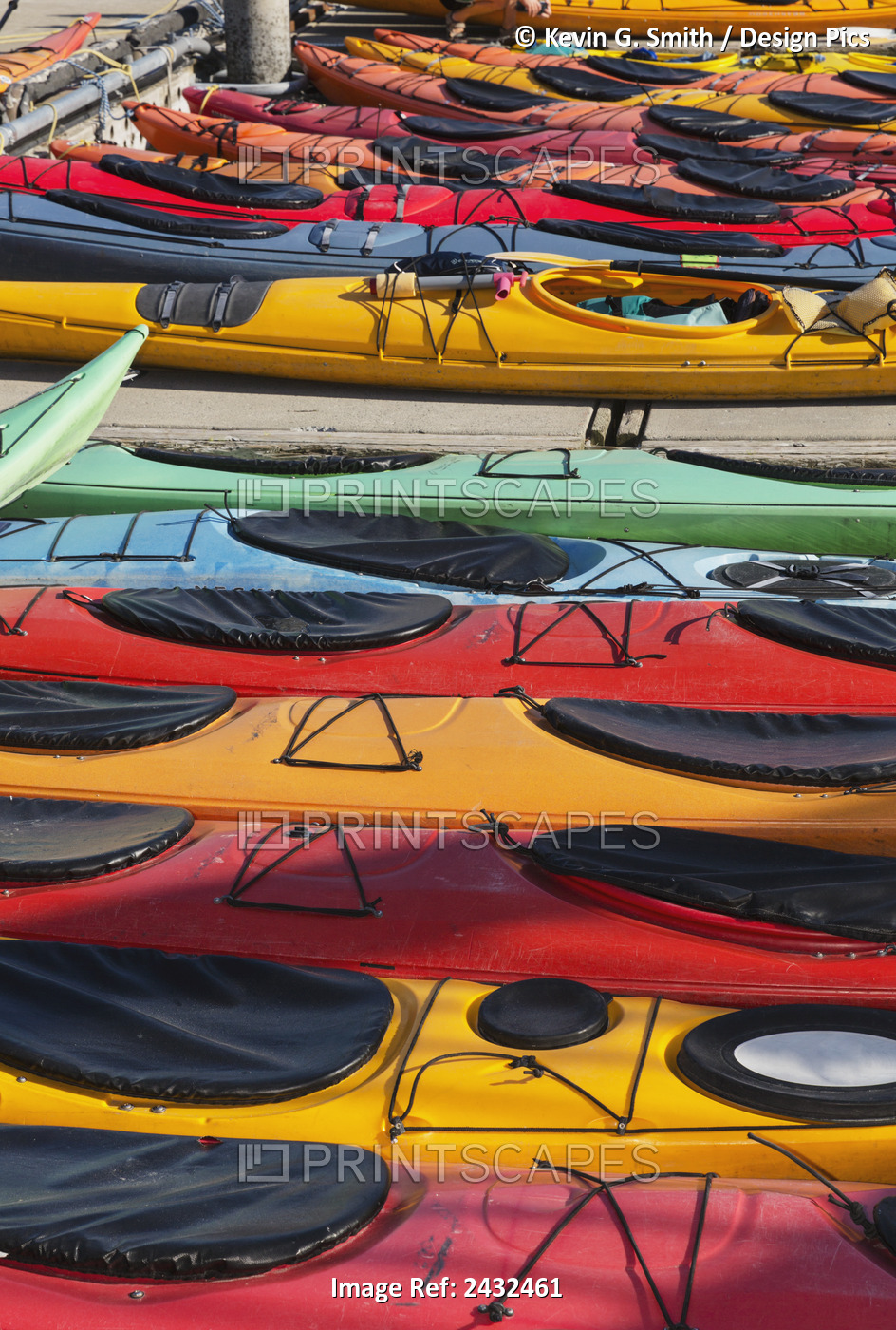 Multi-Coloured Kayaks Together At Boat Dock, Prince William Sound; Valdez, ...