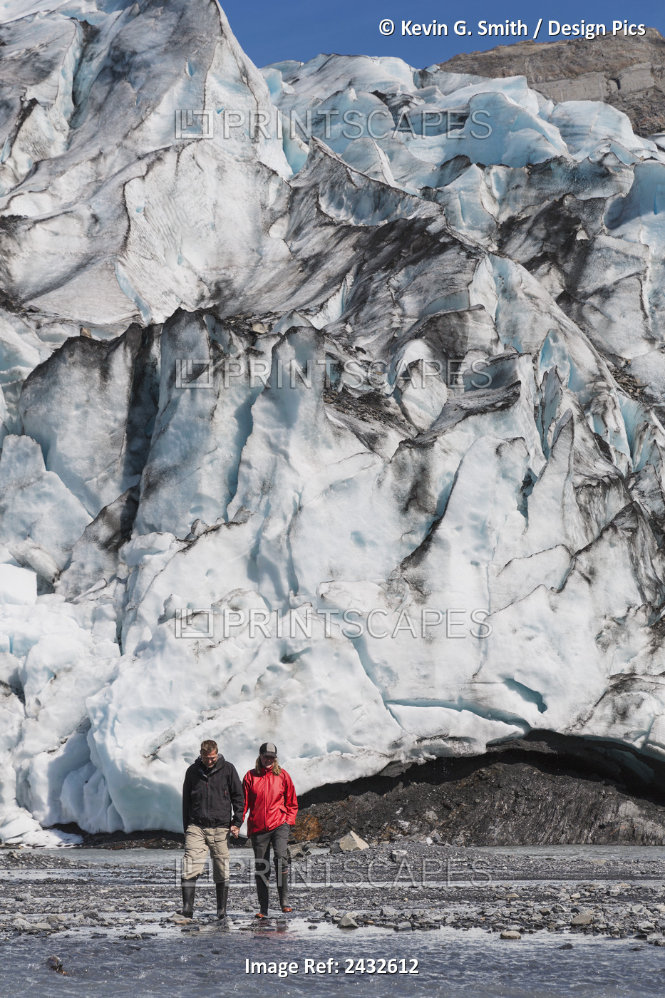 Couple Hold Hands While Exploring Shoup Glacier, Shoup Bay State Marine Park, ...