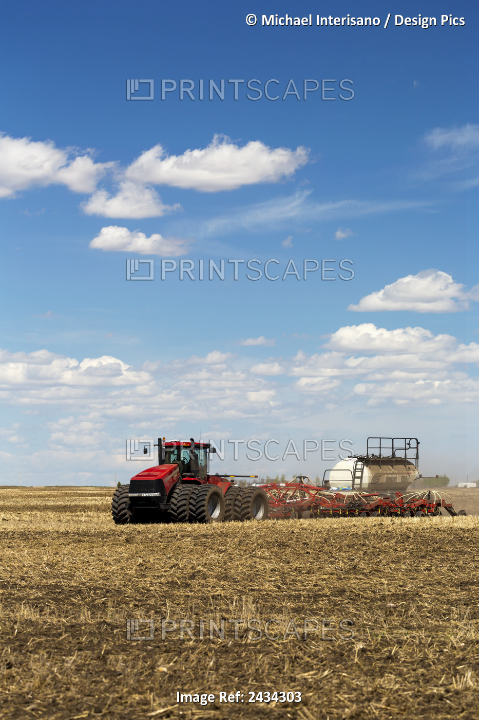 Spring Seeding Of Wheat By A Tractor And Air Till Drill In A Field Of Gain ...