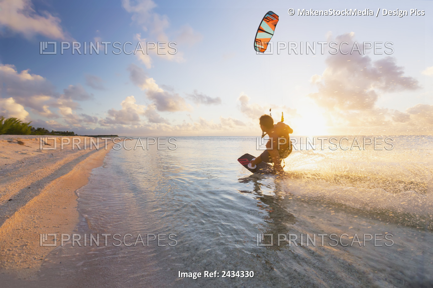 Kiteboarding In Tropical Lagoon In The South Pacific At Sunset; Tikehau, French ...