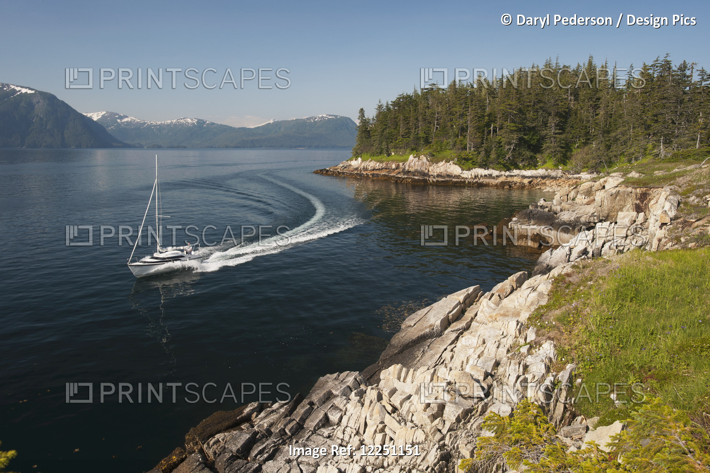 Sailboat Passing Perry Island In Prince William Sound, Southcentral Alaska.