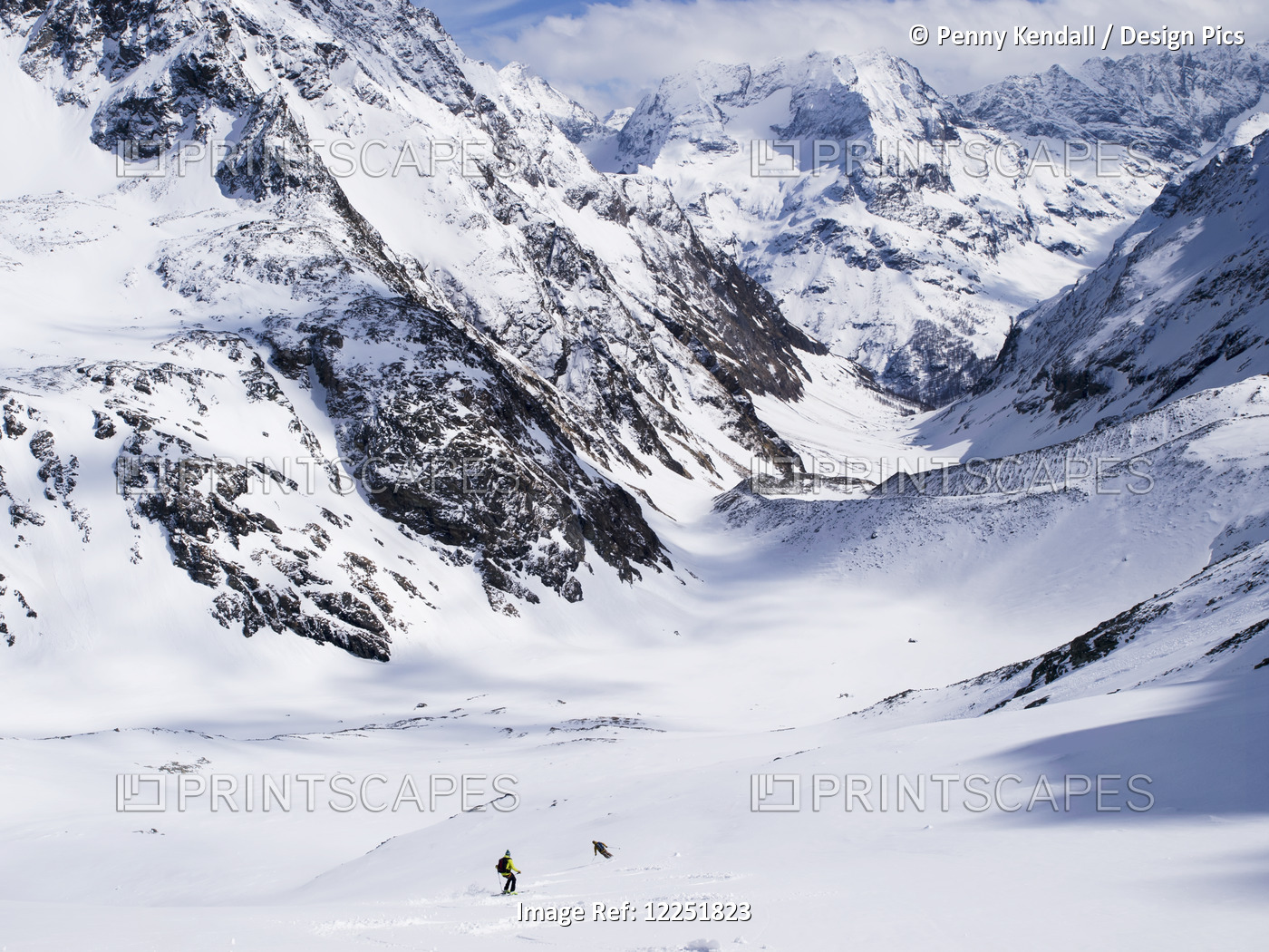 Two Distant Skiers Descend From Chateau De Dames Into Cervinia; Italy