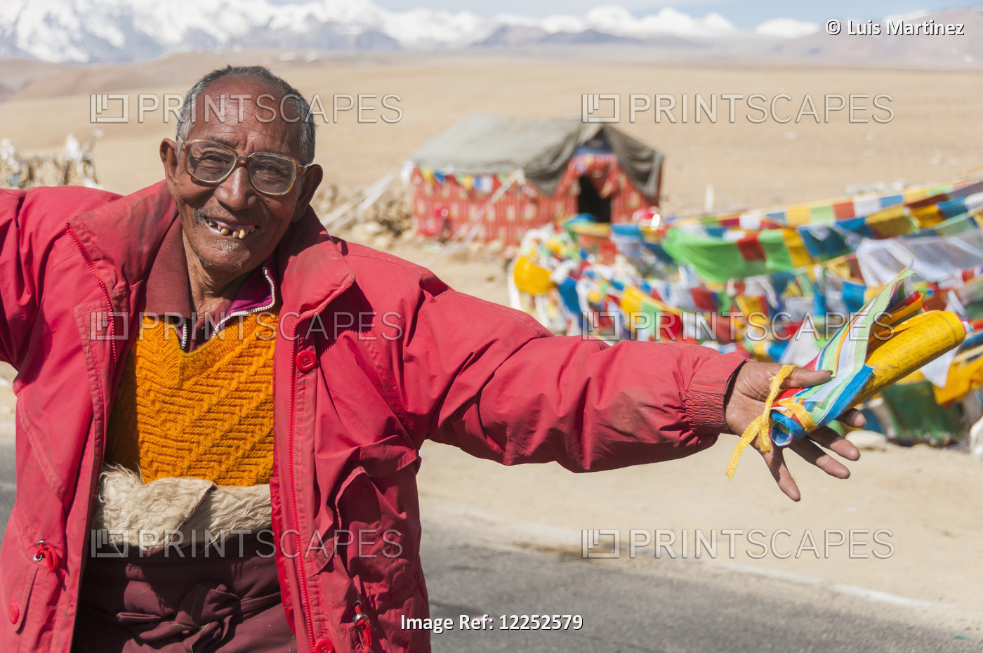 A Crazy Nomad Dancing, Tibetan Flags In His Hands, Showing US His Happiness ...