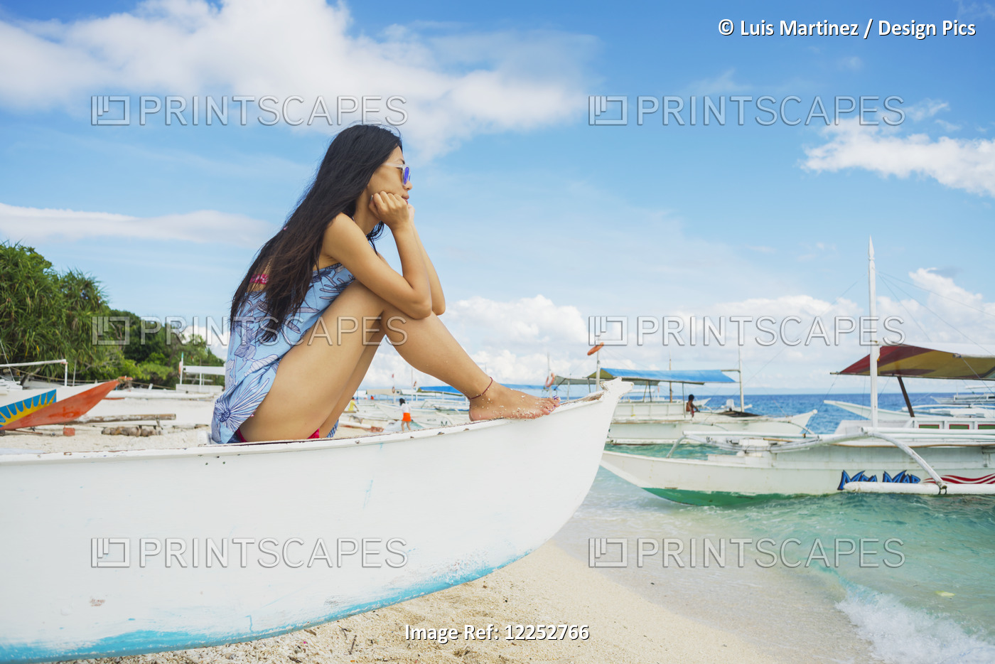 A Young Woman Resting, Watching The Seaside On A Boat; Bohol, Philippines