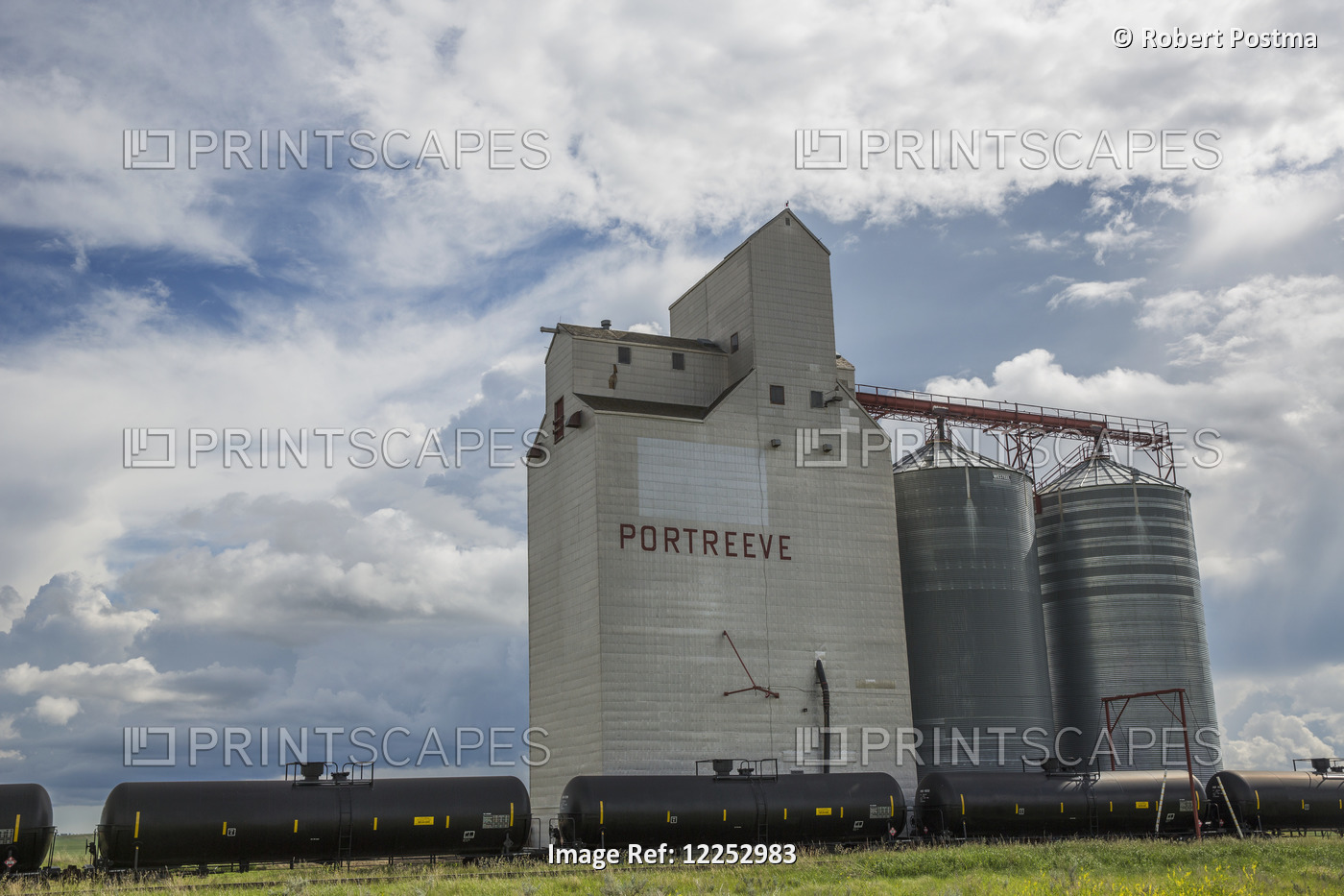 Grain Elevator In Rural Prairies With Cumulonimbus Clouds Building Up Around ...