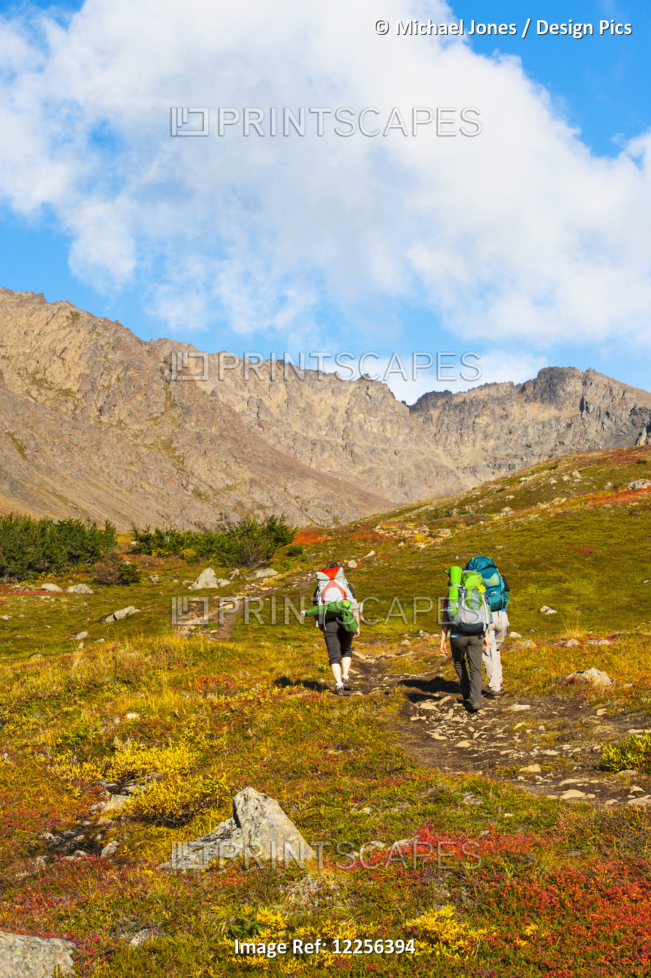 Three Backpackers Are Hiking Up The Hidden Lake Trail In The Chugach State Park ...