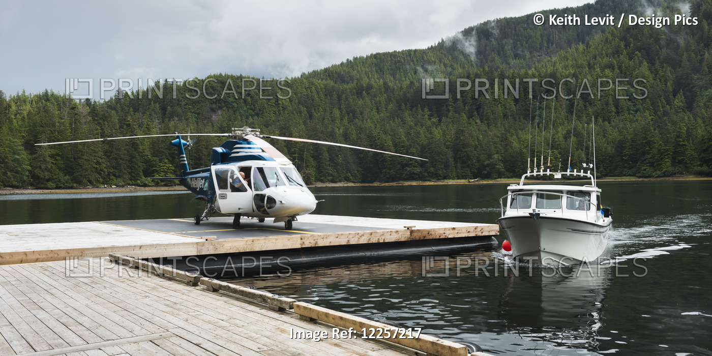 Helicopter On A Dock Alongside A Fishing Boat; Queen Charlotte Islands, British ...