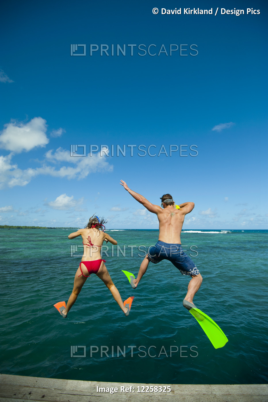 Snorkellers Jumping Into The Waters Off Uplulu Island; Upulu, Samoa
