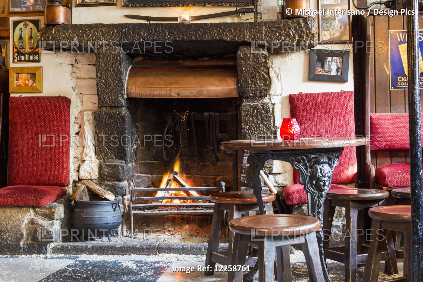 Wood Burning Fireplace With Fire, Old Wooden Stools, And Metal Legged Wooden ...