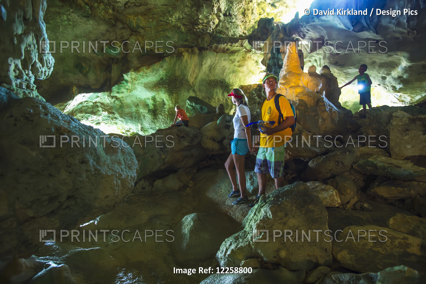 Tourists Exploring In A Cave; Niue