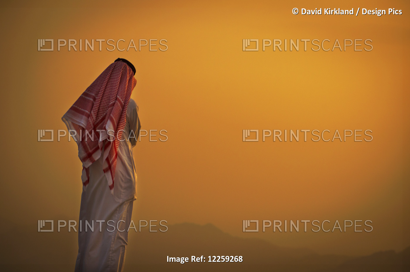 Saudi Standing To Watch The Glowing Orange Sunset; Taif, Saudi Arabia