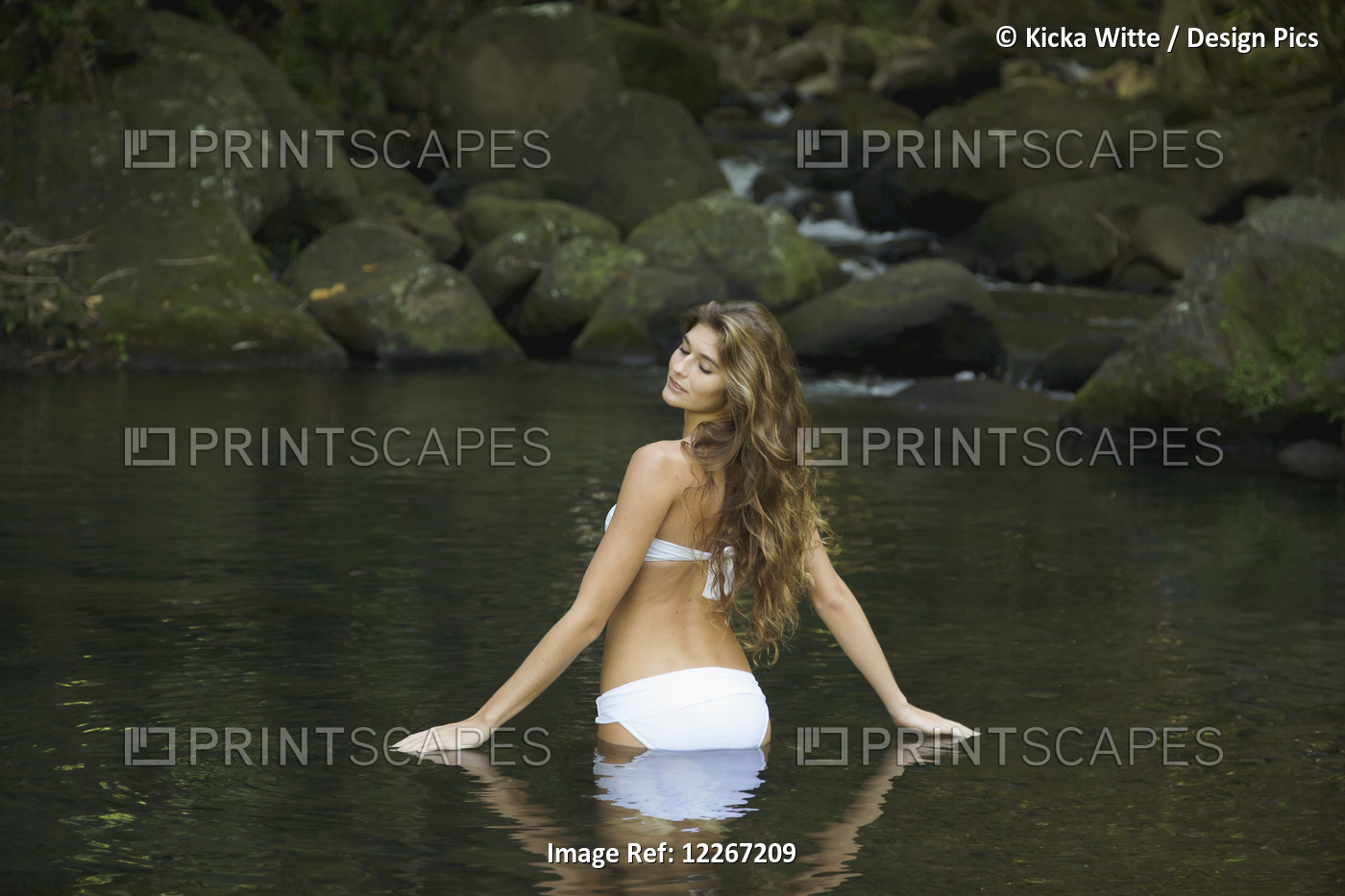 Woman In A White Bikini Standing In The Water; Kauai, Hawaii, United States Of ...