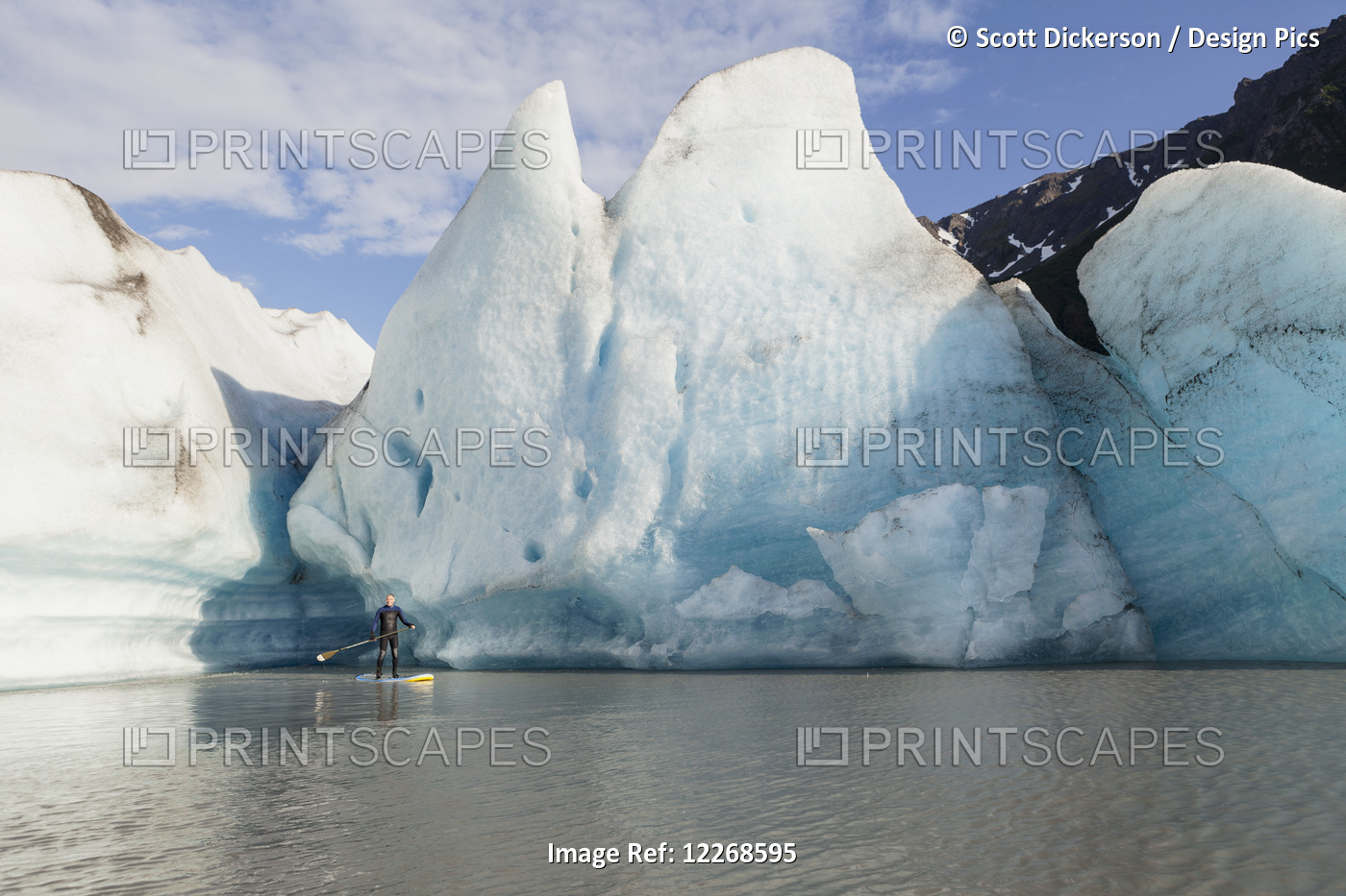 One Person Stand Up Paddleboarding In Front Of Grewingk Glacier, Kachemak Bay ...