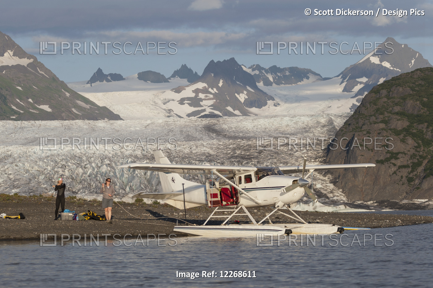 People Unloading Gear From A Floatplane In Front Of Grewingk Glacier In ...
