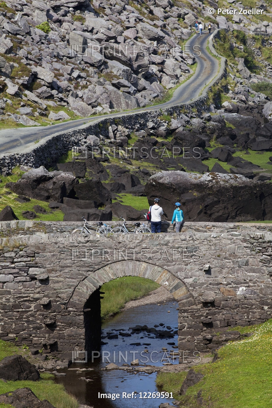 Cyclists On A Road In The Gap Of Dunloe, Near Killarney; County Kerry, Ireland