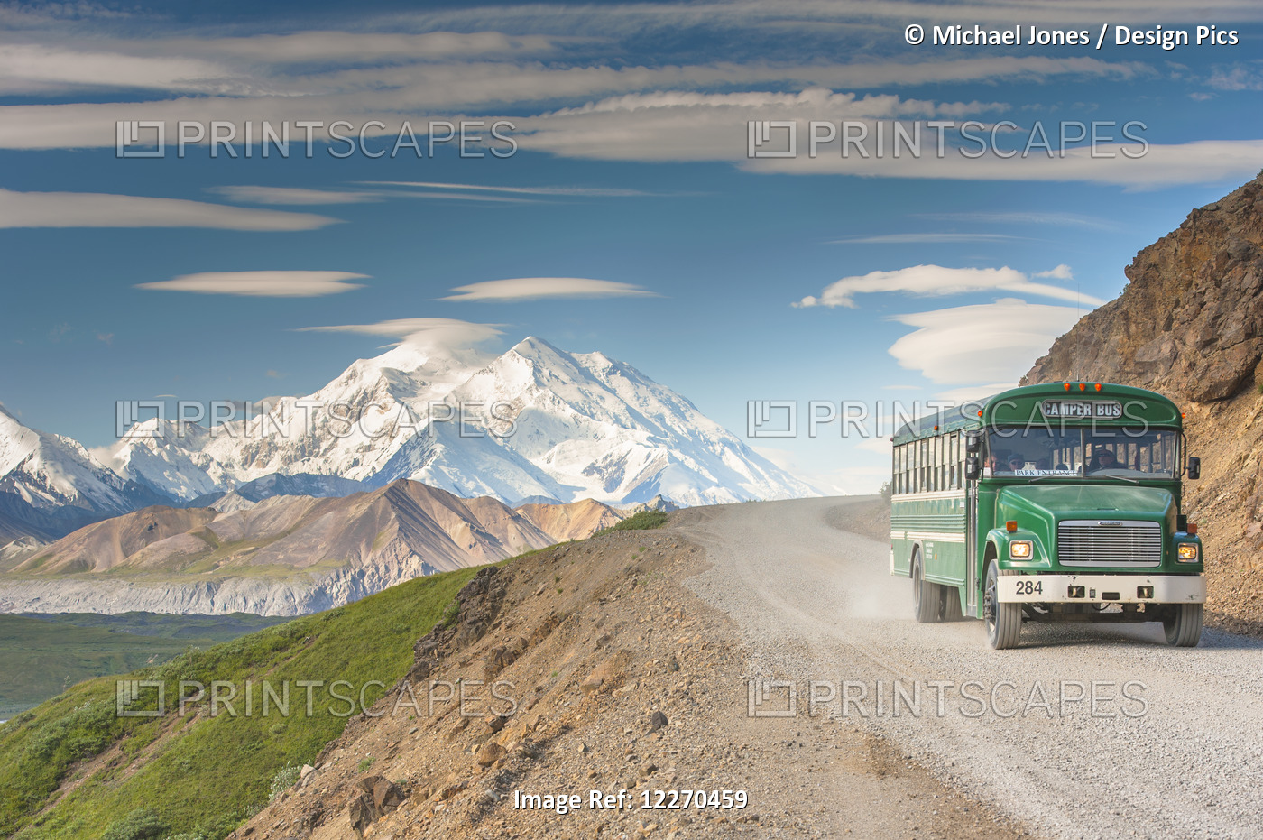 Scenic View Of Mt. Mckinley With A Tour Bus On The Park Road In The Foreground, ...