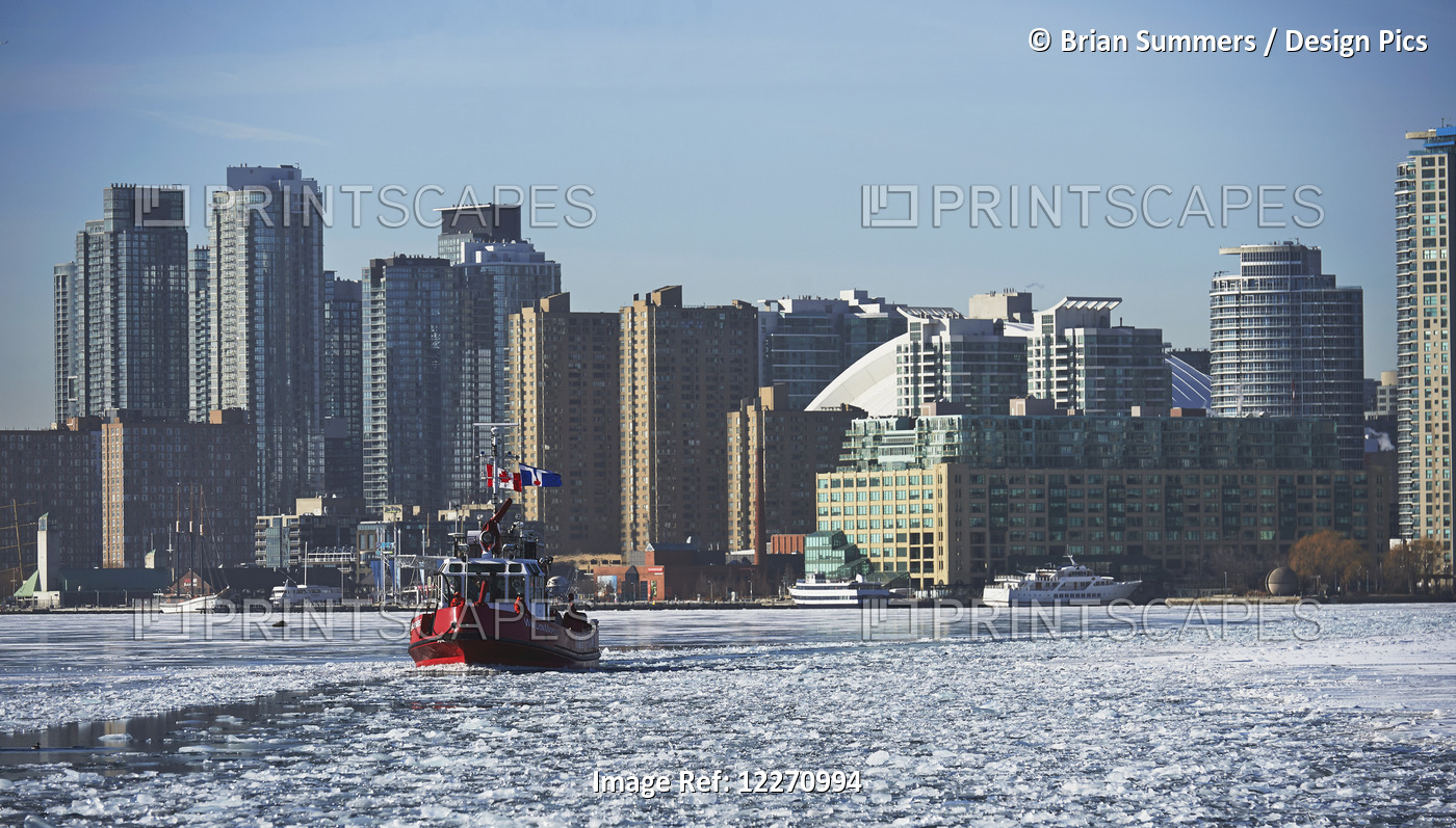 Fire Rescue Boat Against City Skyline From Ward's Island In Winter; Toronto, ...