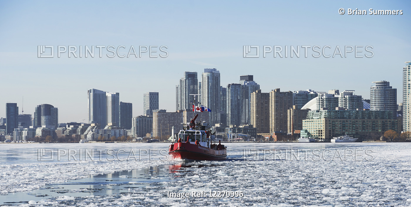 Fire Rescue Boat Against City Skyline From Ward's Island In Winter; Toronto, ...