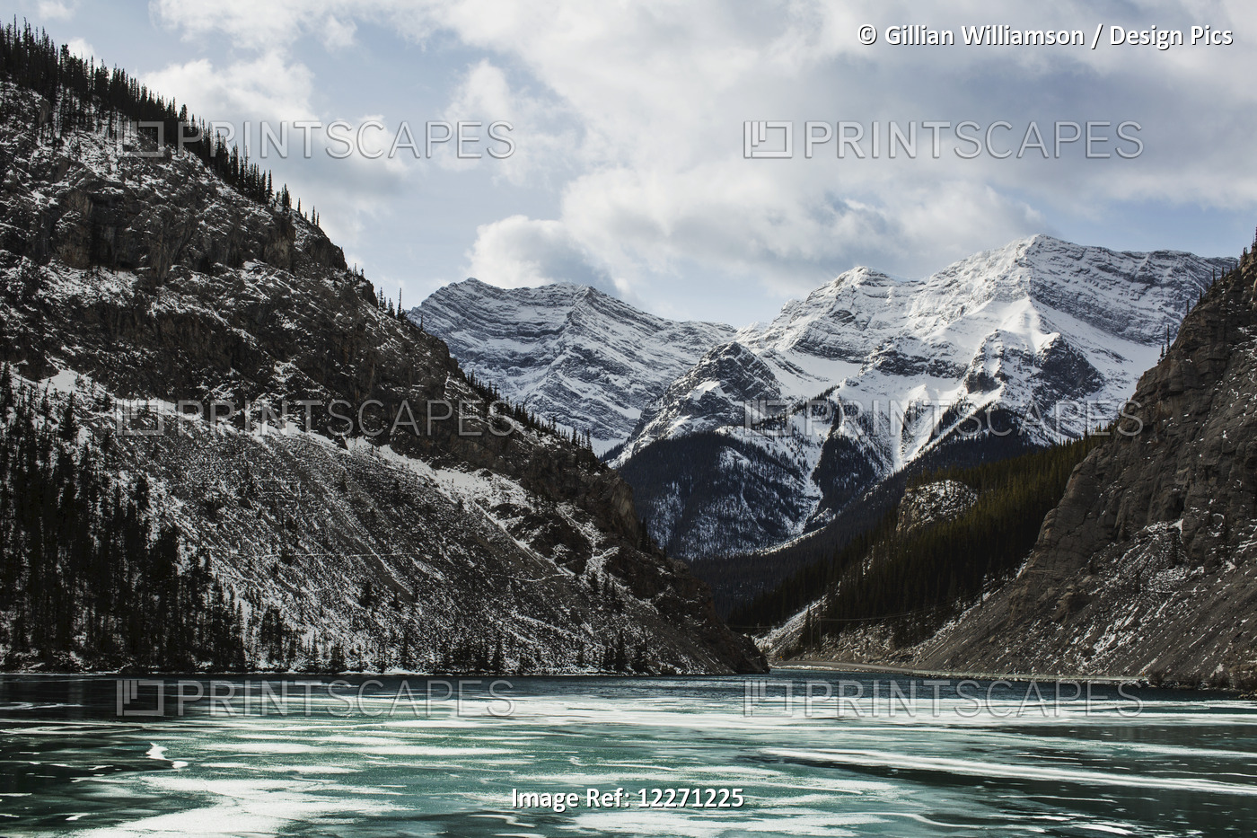 Mountains And Frozen Lake In Winter, Bow Valley Wildland; Alberta, Canada