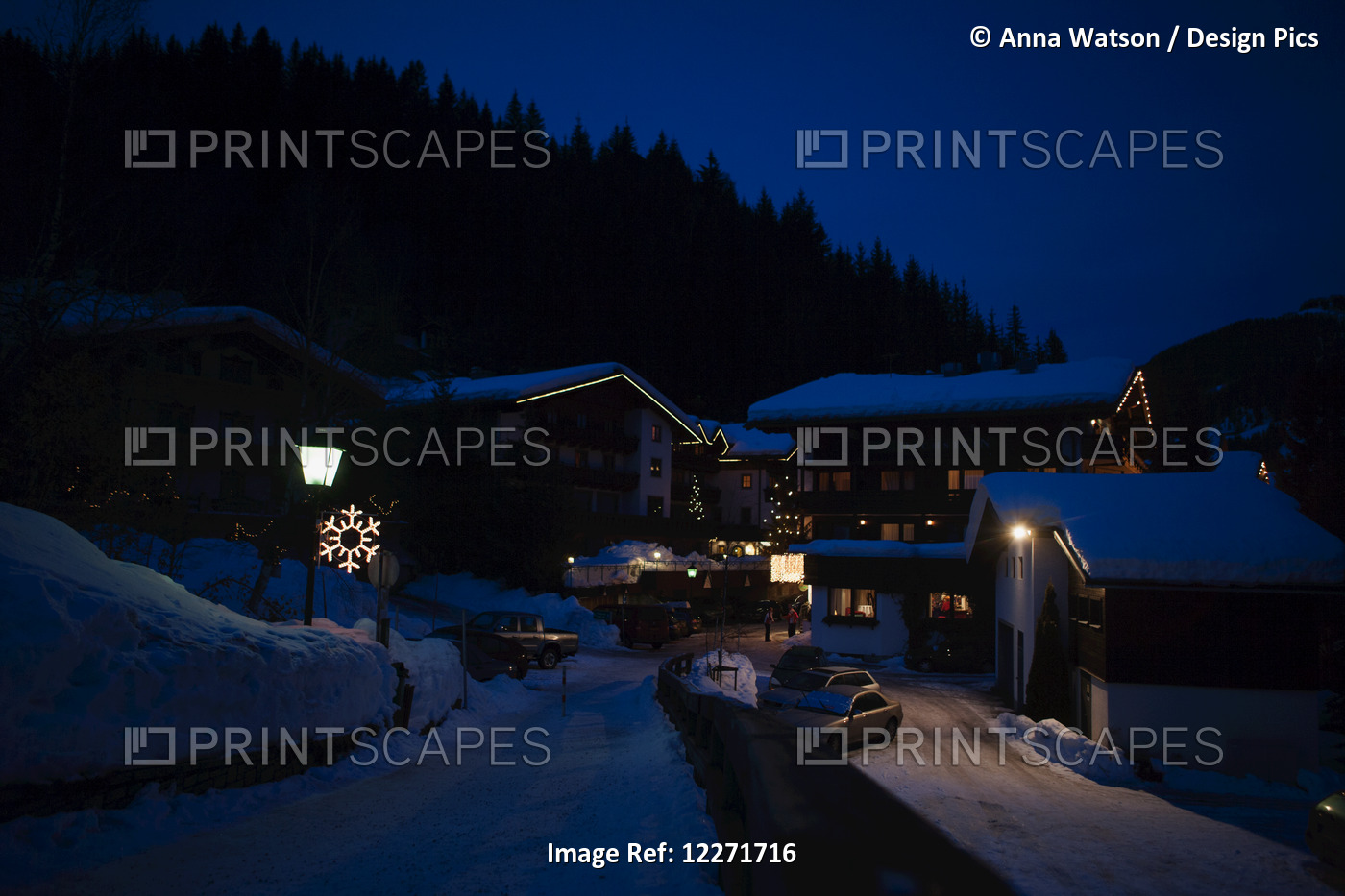 Snow Covered Rooves In The Alpine Village At Night With Snowflake Light And ...