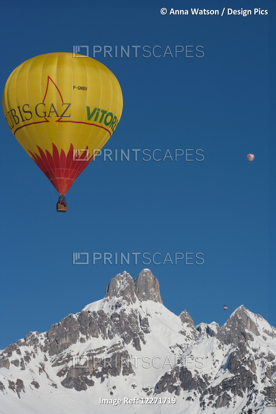 Hot Air Balloons Floating High Above Snowy Bishop's Hat Mountain Peaks During ...