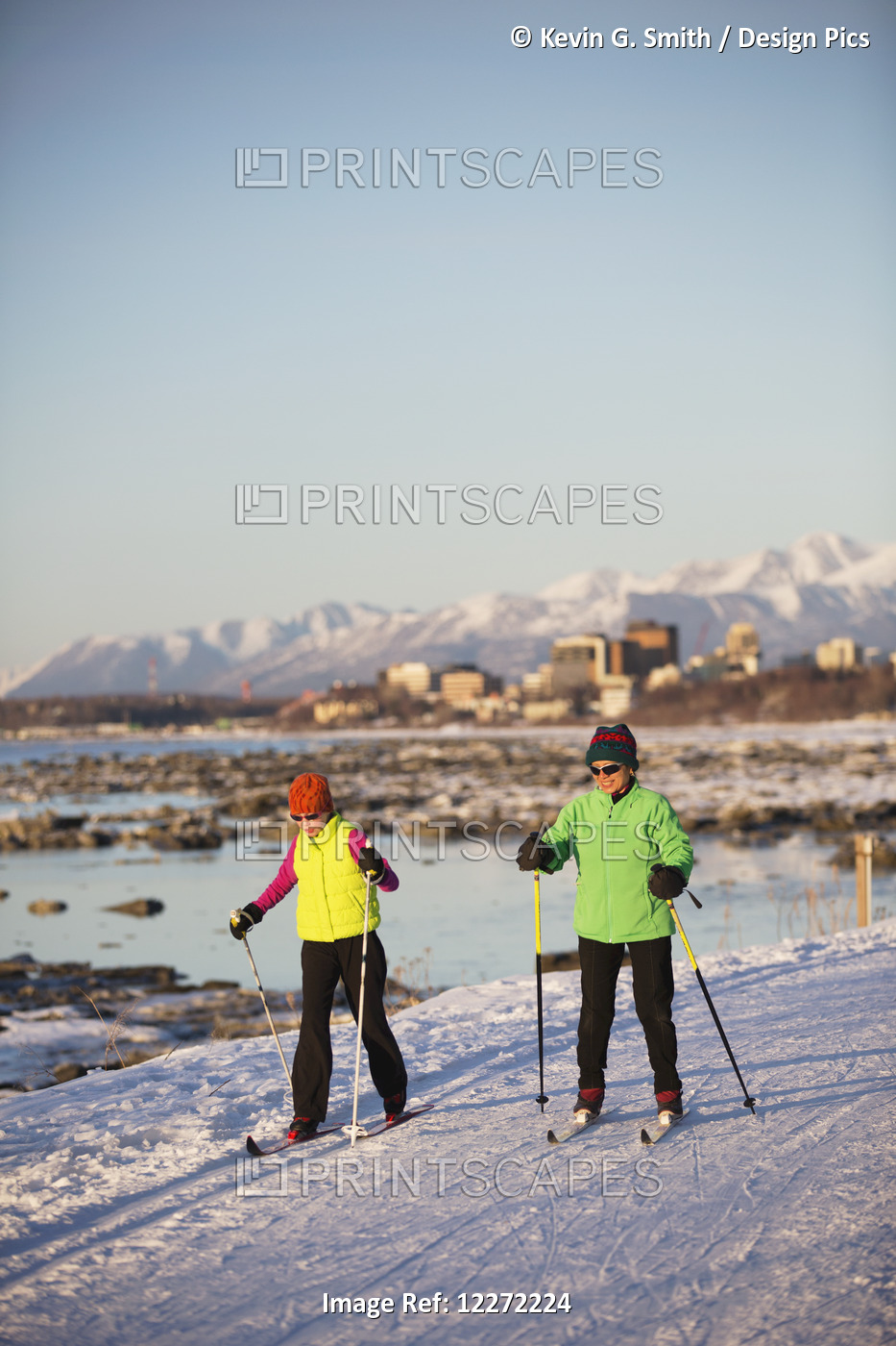 Two People Cross Country Skiing On The Tony Knowles Coastal Trail With ...