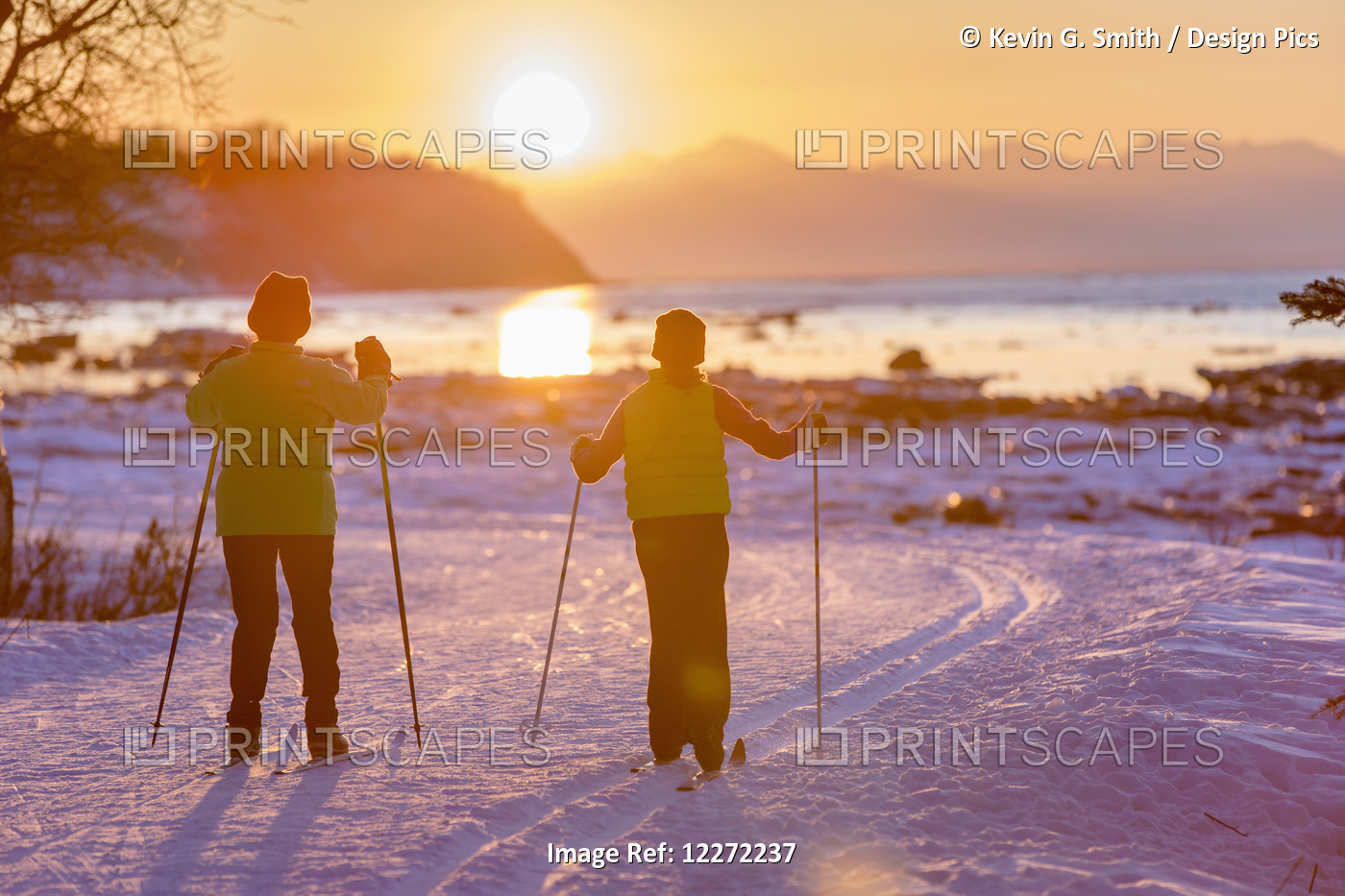 Two Back Lit People Cross Country Skiing On The Tony Knowles Coastal Trail At ...