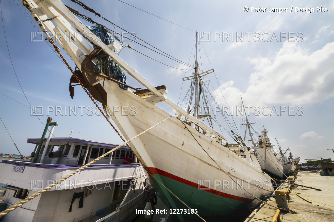 Pinisi, Traditional Two Masted Wooden Cargo Sailing Ships Moored In Paotere ...